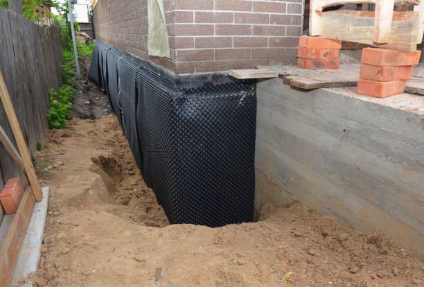 SJ Waterproofing Pros technician performing targeted Interior Drainage System assessment in Lima, OH